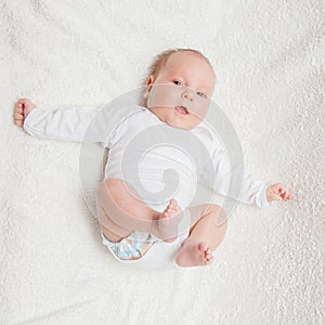 Newborn baby in white romper
