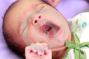 Newborn baby yawning