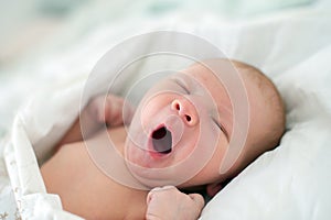 Newborn baby yawning