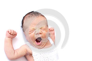 Newborn baby yawns, white background, copy space. Sleep sippers, funny face of a child, emotions. daily routine, time to sleep