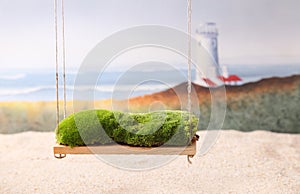 Newborn backdrop prop of a swing with moss.