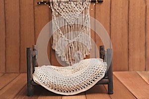 Newborn background - wooden bed with rustic throw and macrame