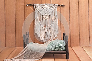 Newborn background - wooden bed with rustic throw and macrame