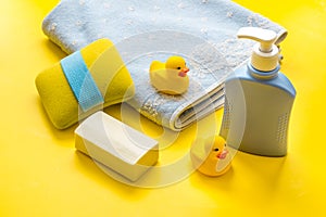 Newborn bath time concept with care cosmetics product