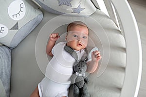 Newborn boy lies in a round bed