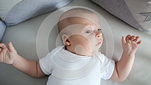 Newborn boy lies in a round bed