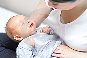 Newborn is crying because of colic pain