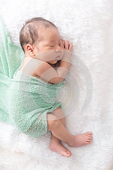 Baby boy sleep on  a white wrap cloth feelgood relaxing photo