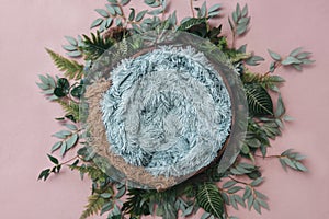 Newborn digital background - wooden bowl with pink faux fur on jute layer and pink backdrop and green leaves wreath photo