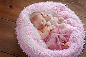 Newborn Girl Sleeping with a Bunny Stuffed Animal