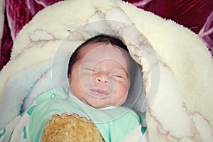 Newborn girl smiling