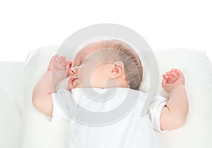 Newborn infant baby girl sleeping on her back