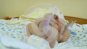 A newborn infant in maternity hospital. Happy parenthood. Healthy kid getting ready to be driven home. Full hd