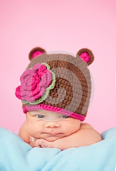 Newborn in knitted hat photo
