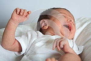 Newborn Latina baby girl crying