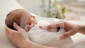 Newborn and mother hands