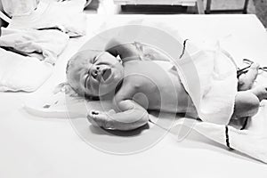 Newborn in nursery after childbirth.