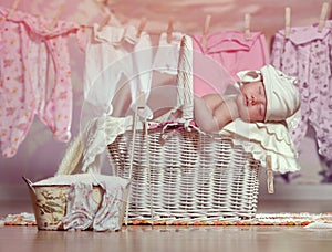 Newborn sleep in the basket after helping her mother in the laundry washing