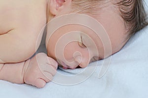 Newborn is sleeping close up