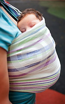 Newborn in sling