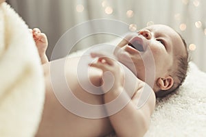 Newborn smiling widely photo