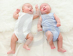 Newborn twins sleeping baby