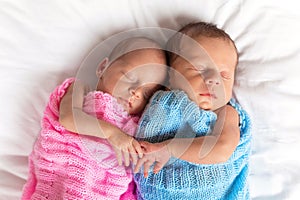 Newborn twins sleeping together