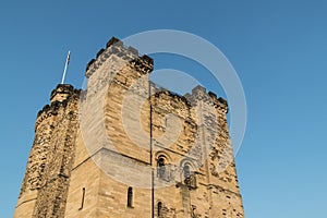Newcastle Castle Keep viewed from below with blue sky
