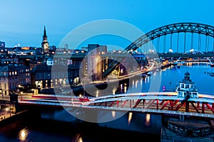 Newcastle Gateshead Quayside at night, with of Tyne Bridge and city skyline