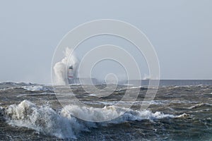 Newhaven Lighthouse in Stormy Sea photo