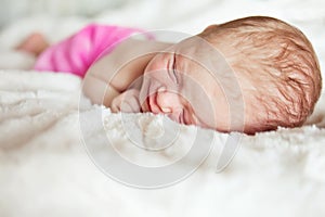 Newly born child in pink bucket