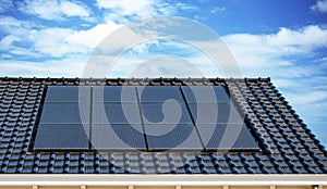 Newly build houses with solar panels attached on the roof against a sunny sky