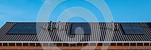 Newly build houses with solar panels attached on roof against a sunny sky Close up of solar pannel