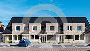 Newly build houses with solar panels attached on roof against a sunny sky Close up of solar pannel