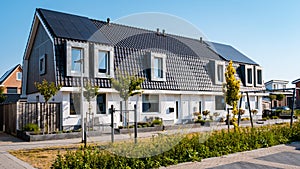 Newly build houses with solar panels attached on roof against a sunny sky Close up of solar pannel