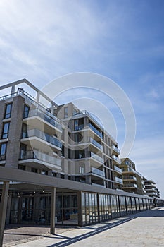 Newly built apartment lots and shopping mall at Kijkduin beach photo