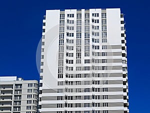 Newly built houses in the newly built area of the city. Perspective construction of apartments. Infrastructure and industry.