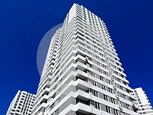 Newly built houses in the newly built area of the city. Perspective construction of apartments. Infrastructure and industry.