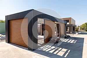 Newly built metal framed building with siding. Construction of a new tiny house. selective focus