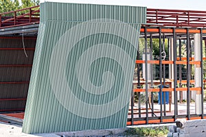 Newly built metal framed building with siding. Construction of a new tiny house. selective focus