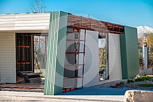 Newly built metal framed building with siding. Construction of a new tiny house. selective focus