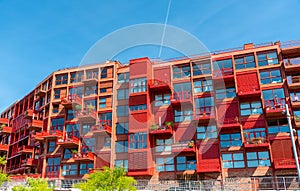 Newly built red multi-family apartment house