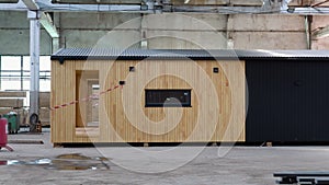 Newly built single storey prefabricated modular building. Prefabricated mobile wooden house at construction site
