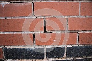 Newly constructed brick wall with subsidence damage visible cracking