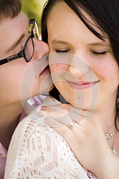 Newly Engaged Couple Sharing a Moment in the Park