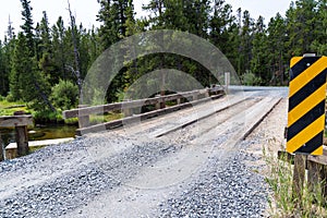 Newly graded gravel road over a bridge spanning the Little Popo Agie River outside of Lander, Wyoming