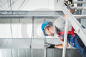 Newly Installed Commercial Air Duct Check Performed by Professional Worker