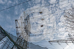 A newly installed high-voltage pylon with some cables connected