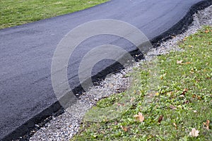 Newly Laid Asphalt Path Through a Park