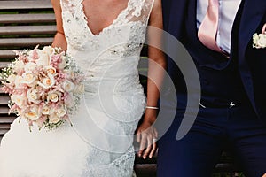 Newly-married couple dressed as bride and groom photo